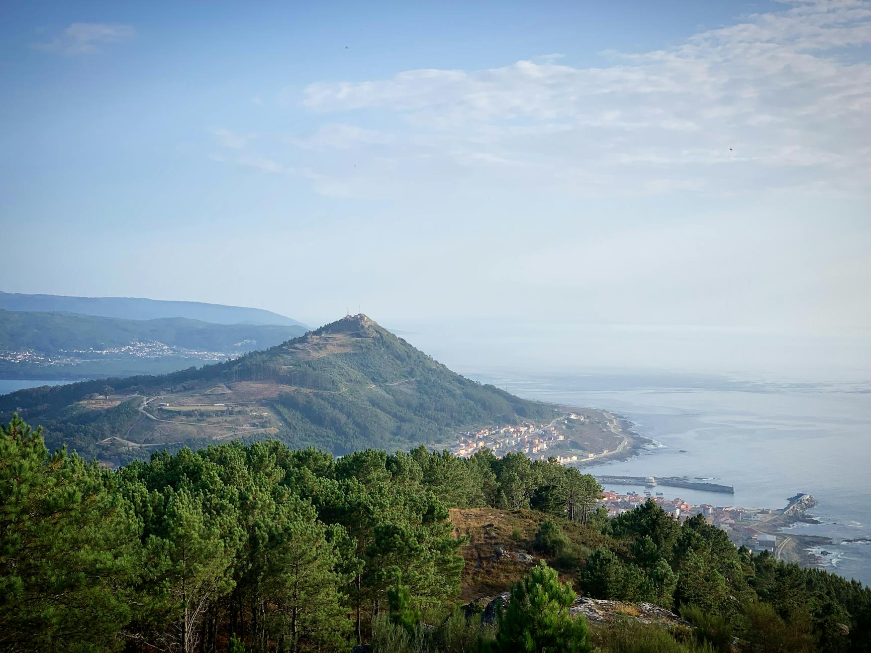 Breathtaking view of the coastline from Serra da Arga, Portugal. Lush greenery and oceanic horizon at daytime.