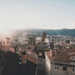 Captivating sunrise over Orense, Spain, highlighting the historic architecture and urban skyline.