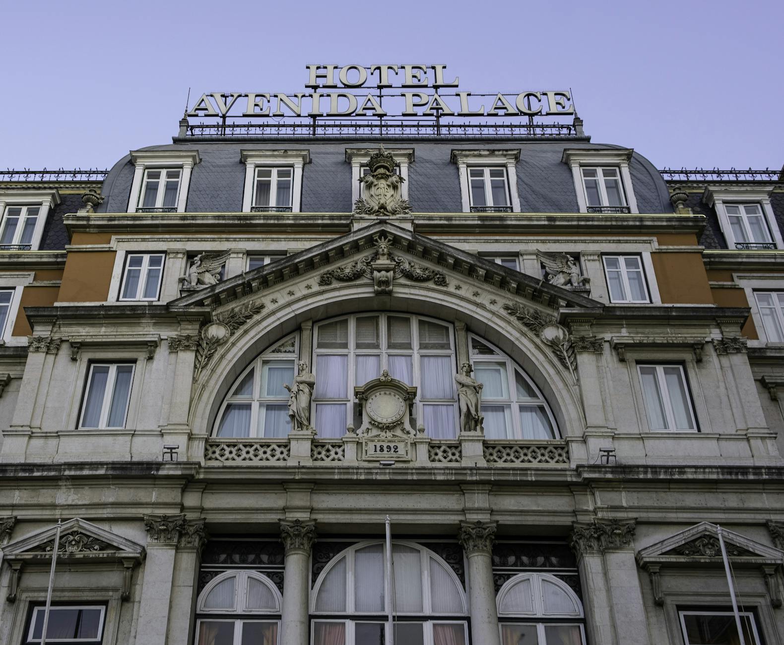 A majestic view of the Avenida Palace Hotel facade, capturing its ornate architecture in Lisbon, Portugal.