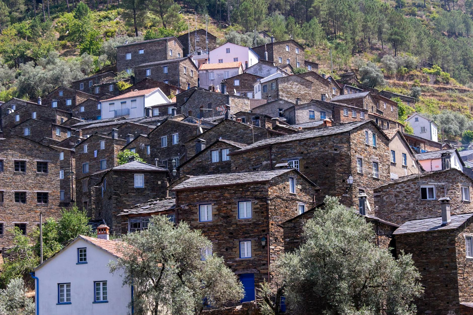 Explore the historic charm of Piódão village with its unique stone architecture nestled in Portugal's scenic mountains.