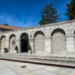 Stone arches in Ávila‎, Spain, featuring traditional Spanish architecture.