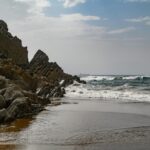 Explore the stunning rocky coastline of País Vasco with dramatic cliffs and crashing waves.
