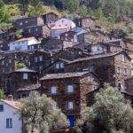 Explore the historic charm of Piódão village with its unique stone architecture nestled in Portugal's scenic mountains.