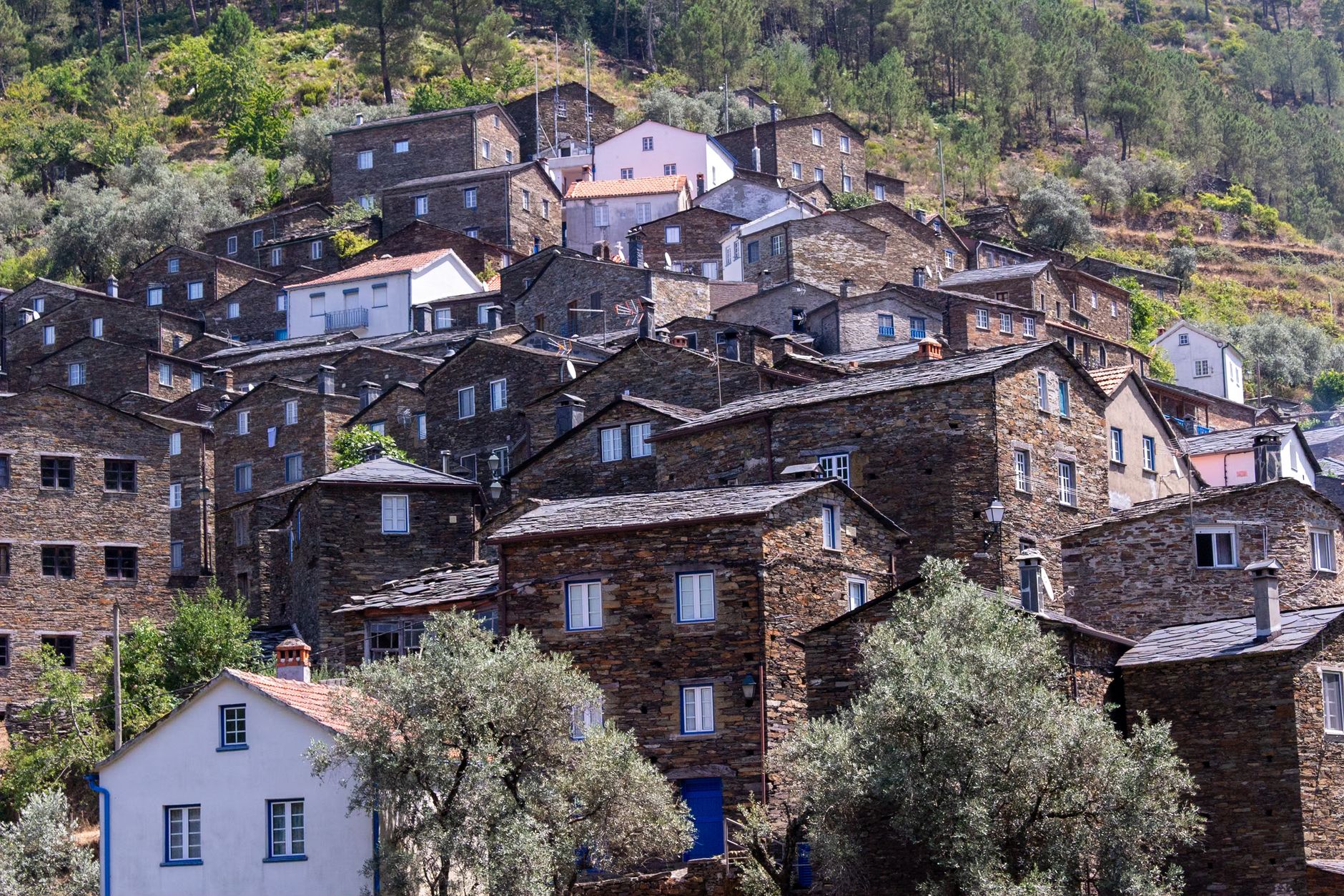 Explore the historic charm of Piódão village with its unique stone architecture nestled in Portugal's scenic mountains.
