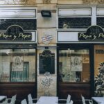 Front view of 'Pepa y Pepe' tapas bar showcasing signage and outdoor seating.
