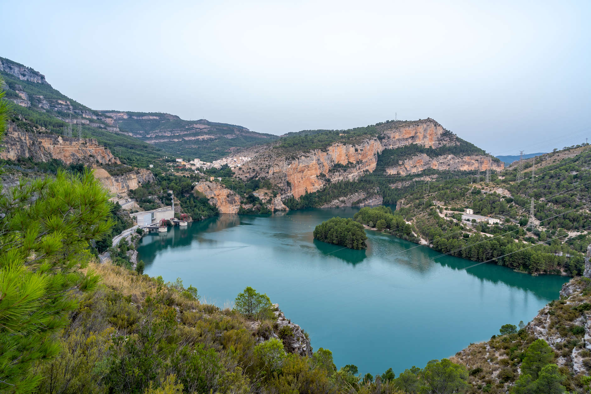 Stunning landscape of turquoise lake and cliffs in Cortes de Pallás, Spain.