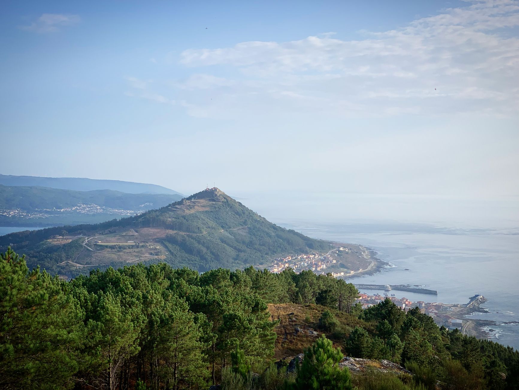 Breathtaking view of the coastline from Serra da Arga, Portugal. Lush greenery and oceanic horizon at daytime.
