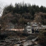Rustic house nestled in the forests of Betws-y-Coed, Wales, surrounded by natural beauty.