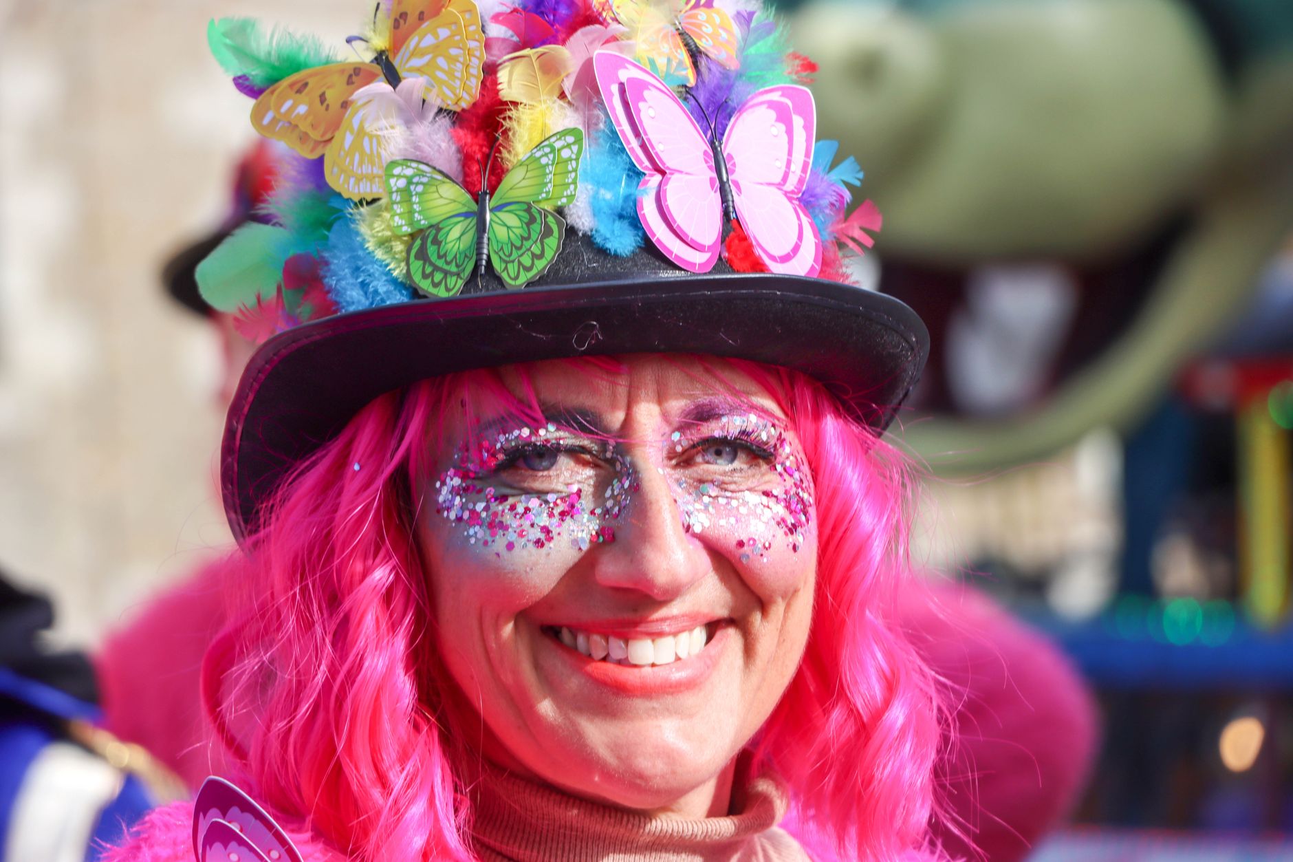 Colorful portrait of a person in vibrant carnival dress during festival in Granville, France.