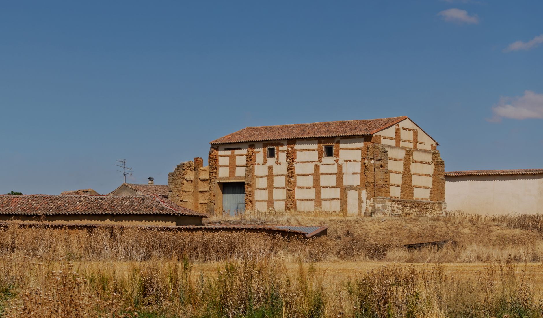 Explore the weathered charm of a rustic barn set in the fields of La Unión de Campos, Spain.