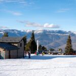 A sunny day at Masella Ski Resort, Spain with snow-covered slopes and mountain views.