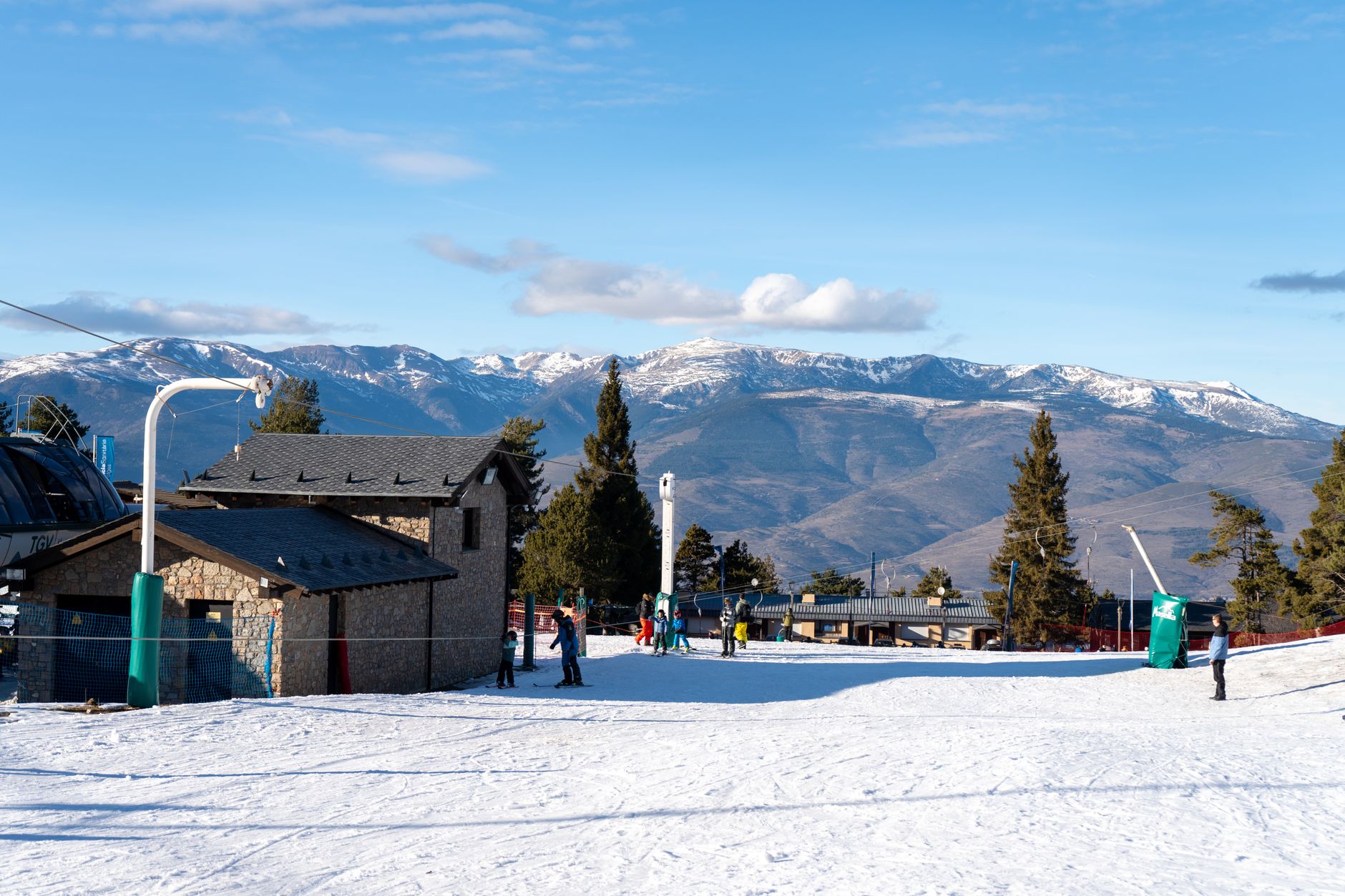 A sunny day at Masella Ski Resort, Spain with snow-covered slopes and mountain views.
