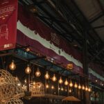Warm lighting and rustic decor inside the Mercado de las Pulgas flea market in Buenos Aires, Argentina.