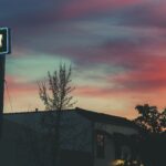 Colorful neon art studio sign illuminated at twilight in Paso Robles, California.